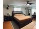 Relaxing main bedroom featuring a ceiling fan, wooden floors, and ample natural light at 255 Belinda Dr, Deland, FL 32720