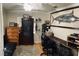 This spacious office has a mounted fish, workstation desk, and a gun cabinet for storage at 255 Belinda Dr, Deland, FL 32720