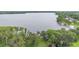 Expansive lakefront property featuring a private dock and lush green surroundings at 2652 Lake Howell Ln, Winter Park, FL 32792