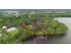 Lakefront estate with private dock, lush landscaping, and property outline at 2652 Lake Howell Ln, Winter Park, FL 32792