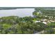 Aerial view of a lakeside community with stunning waterfront views and lush landscaping at 2652 Lake Howell Ln, Winter Park, FL 32792
