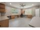Large and bright bonus room with ceiling fan and built-in cabinetry at 2652 Lake Howell Ln, Winter Park, FL 32792
