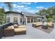 Beautiful outdoor deck with comfortable seating and a grill at 2652 Lake Howell Ln, Winter Park, FL 32792