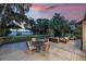 Outdoor deck area complete with stylish furniture and serene waterfront view at 2652 Lake Howell Ln, Winter Park, FL 32792