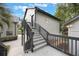 Back apartment exterior with stairs leading to second floor entrance at 2652 Lake Howell Ln, Winter Park, FL 32792