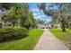 Well-maintained home featuring dual garages, and a long brick paved driveway at 2652 Lake Howell Ln, Winter Park, FL 32792
