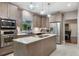 Modern kitchen with stainless steel appliances, white countertops, and stylish wood cabinetry at 2652 Lake Howell Ln, Winter Park, FL 32792