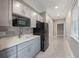 Kitchenette equipped with modern appliances, cabinets, and a sleek countertop at 2652 Lake Howell Ln, Winter Park, FL 32792
