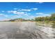 Picturesque lake view with trees and docks dotting the shoreline at 2652 Lake Howell Ln, Winter Park, FL 32792