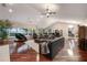 Expansive living room featuring hardwood floors, high ceilings, and large windows at 2652 Lake Howell Ln, Winter Park, FL 32792