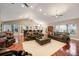 Spacious living area featuring hardwood floors, high ceilings, and open floor plan at 2652 Lake Howell Ln, Winter Park, FL 32792