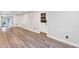 Finished basement featuring a large living area with luxury vinyl plank flooring and a glass paneled door at 2910 Hargill Dr, Orlando, FL 32806