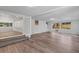Open living area with wood floors, white walls, and french doors that lead to another section at 2910 Hargill Dr, Orlando, FL 32806