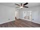 Living room features luxury vinyl plank flooring, a ceiling fan, and glass paneled doors at 2910 Hargill Dr, Orlando, FL 32806