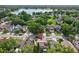 Aerial view of home showing mature trees and landscaping in established neighborhood, near a lake at 2971 Cayman Way, Orlando, FL 32812