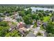 Aerial view of home showing mature trees and landscaping in established neighborhood, near a lake at 2971 Cayman Way, Orlando, FL 32812