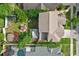 Aerial shot showing a backyard with a hot tub, picnic table and storage shed at 2971 Cayman Way, Orlando, FL 32812