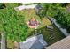 Birds eye view showing a backyard with a hot tub, picnic table and storage shed at 2971 Cayman Way, Orlando, FL 32812