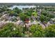 Aerial view of home showing mature trees and landscaping in established neighborhood, near a lake at 2971 Cayman Way, Orlando, FL 32812