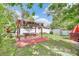Relaxing backyard with a covered patio, lush greenery, and a private, fenced-in space at 2971 Cayman Way, Orlando, FL 32812