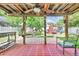 Inviting backyard featuring a covered patio, a grill, and an outdoor space for relaxation at 2971 Cayman Way, Orlando, FL 32812