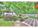 Serene backyard retreat featuring lush landscaping, a covered patio, and outdoor amenities at 2971 Cayman Way, Orlando, FL 32812