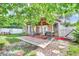 Picturesque backyard features a covered patio, outdoor seating, and a well-manicured lawn at 2971 Cayman Way, Orlando, FL 32812