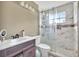 Bathroom featuring a tiled shower with glass doors, a modern vanity, and stylish fixtures at 2971 Cayman Way, Orlando, FL 32812