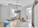 Simple bedroom with a ceiling fan, small TV and a view into the en-suite bathroom at 2971 Cayman Way, Orlando, FL 32812