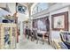 Elegant dining room with high ceilings, large windows, and ornate furniture, perfect for entertaining at 2971 Cayman Way, Orlando, FL 32812