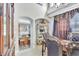 Elegant dining room showcasing an arched entrance to the kitchen and ornate decorations at 2971 Cayman Way, Orlando, FL 32812