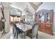 Spacious dining area with a large cabinet, perfect for gatherings and showcasing decor at 2971 Cayman Way, Orlando, FL 32812