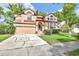 Two-story home with a two-car garage and a well-manicured front yard at 2971 Cayman Way, Orlando, FL 32812