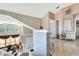 Bright hallway featuring tiled floors, arched windows, and stylish decor, enhancing the home's elegance at 2971 Cayman Way, Orlando, FL 32812