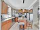 Modern kitchen featuring stainless steel appliances, granite countertops, and a breakfast bar area at 2971 Cayman Way, Orlando, FL 32812