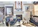 Cozy living room with a fireplace, comfortable seating, and stylish decor at 2971 Cayman Way, Orlando, FL 32812