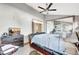 Angle of main bedroom featuring high ceilings, a ceiling fan, and a large leather sleigh bed at 2971 Cayman Way, Orlando, FL 32812