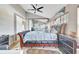 Spacious main bedroom featuring high ceilings, a ceiling fan, and a large leather sleigh bed at 2971 Cayman Way, Orlando, FL 32812