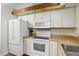 Functional kitchen featuring white appliances and ample cabinet space at 3012 S Semoran Blvd # S, Orlando, FL 32822
