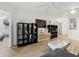 Cozy living room featuring hardwood floors, modern decor, and plenty of natural light at 3012 S Semoran Blvd # S, Orlando, FL 32822