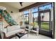 Enclosed patio with comfortable seating, decor, and sliding glass doors to the exterior at 3012 S Semoran Blvd # S, Orlando, FL 32822