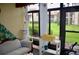 Bright sunroom with large windows offering serene outdoor views and light decor at 3012 S Semoran Blvd # S, Orlando, FL 32822