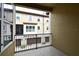 Balcony view of building exterior showcasing multiple garages and windows at 312 Trieste Loop, Lake Mary, FL 32746