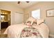 Bedroom with a bed, closet, neutral walls, a window and bathroom access at 312 Trieste Loop, Lake Mary, FL 32746