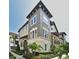 Stunning townhome showcasing architectural details, manicured landscaping, and a welcoming facade at 312 Trieste Loop, Lake Mary, FL 32746