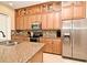 Modern kitchen boasting granite countertops, stainless steel appliances, and abundant storage at 312 Trieste Loop, Lake Mary, FL 32746