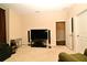 Spacious living room with a modern entertainment center and lots of natural light at 312 Trieste Loop, Lake Mary, FL 32746