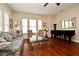 Elegant living room with hardwood floors, bright windows, and stylish furniture at 312 Trieste Loop, Lake Mary, FL 32746