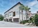 Modern townhouse complex featuring multiple units, garages, and manicured landscaping at 312 Trieste Loop, Lake Mary, FL 32746