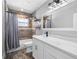 Well-lit bathroom featuring modern fixtures, and a bathtub with shower at 3251 Wickersham Ct, Orlando, FL 32806
